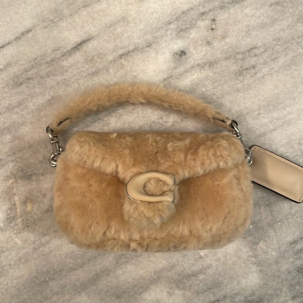 Coach mini shearling pillow tabby